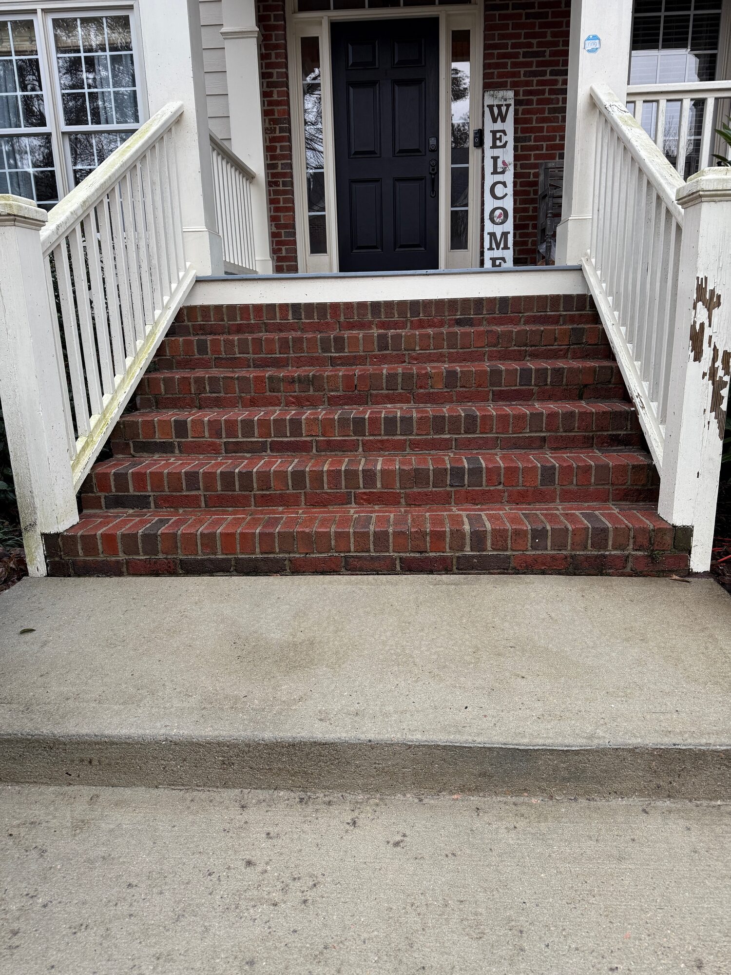The same brick front steps, clean